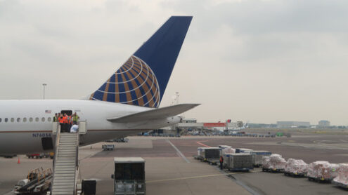 Airplane refueling before take-off.Service staff converse on the - MyVideoimage.com