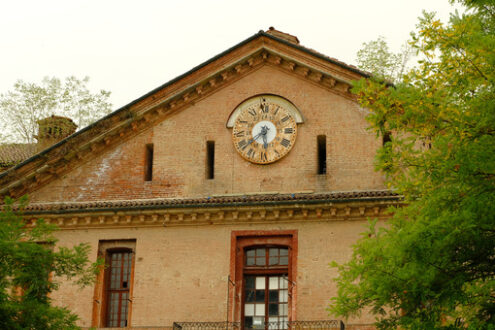 Ancient clock. Ancient clock on the pediment of the building.  Stock photos. - MyVideoimage.com | Foto stock & Video footage