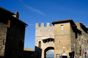 Ancient door San Pietro in Assisi. Made with mixed brick and stone masonry. - MyVideoimage.com