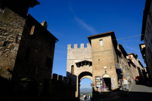 Ancient door San Pietro in Assisi. Made with mixed brick and stone masonry. - MyVideoimage.com