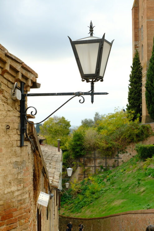 Ancient lantern for street lighting. A street lamp in the city of Siena in Tuscany.  Stock photos. Siena, Tuscany, Italy. - MyVideoimage.com | Foto stock & Video footage