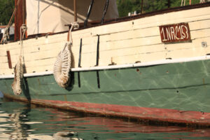 Ancient wooden sailboat anchored in the harbor. In the Mediterra - MyVideoimage.com