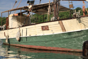 Ancient wooden sailboat anchored in the harbor. In the Mediterra - MyVideoimage.com