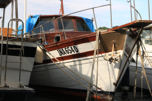 Ancient wooden sailboat anchored in the harbor. In the Mediterra - MyVideoimage.com