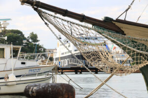 Ancient wooden sailboat anchored in the harbor. In the Mediterra - MyVideoimage.com