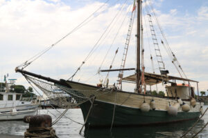 Ancient wooden sailboat anchored in the harbor. In the Mediterra - MyVideoimage.com