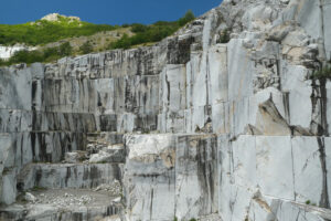 Apuan marble quarry. Wall of a white marble quarry under the mountain. Stock photos. - MyVideoimage.com | Foto stock & Video footage