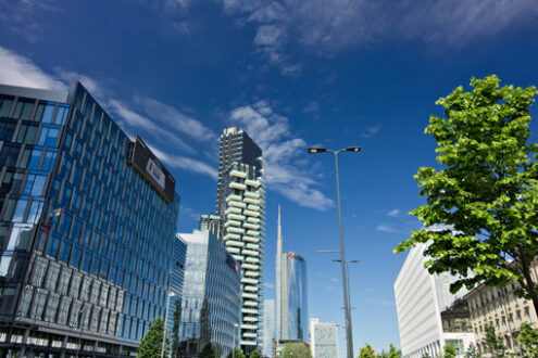 BNL Milano. Modern buildings, skyscrapers, roads and traffic in Milano. Tower buildings, glass skyscrapers. Diamond Tower and car traffic on Via della Conciliazione. - MyVideoimage.com | Foto stock & Video footage