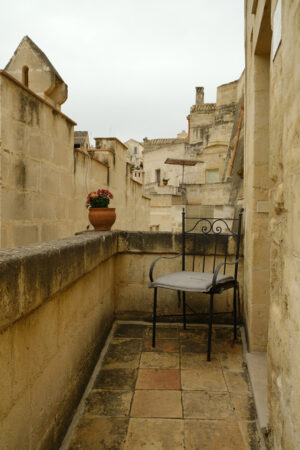 Balcony with chairs. Balcony with iron chairs in a house in the city of Matera. - MyVideoimage.com | Foto stock & Video footage