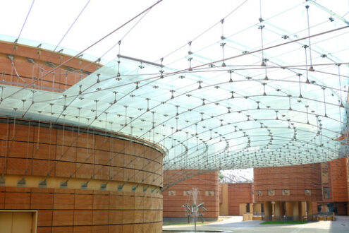 Banco BPM. Modern building with glass roof and brick facade. Foto stock royalty free. - MyVideoimage.com | Foto stock & Video footage