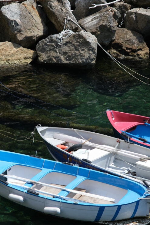 Barche a Riomaggiore Colored boats on the blue sea. Riomaggiore, Cinque Terre. Stock Photos. - MyVideoimage.com | Foto stock & Video footage