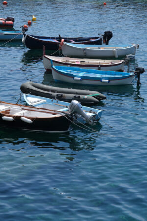 Barche a Riomaggiore. Colored boats on the blue sea. Cinque Terre. Stock Photos. - MyVideoimage.com | Foto stock & Video footage