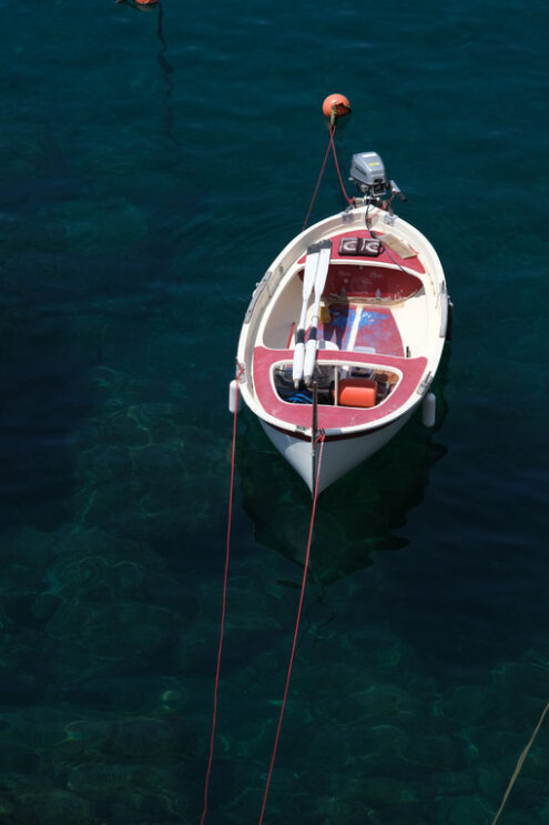 Barche alle Cinqueterre. Colored boats on the blue sea. Riomaggiore, Cinque Terre. Stock Photos. - MyVideoimage.com | Foto stock & Video footage