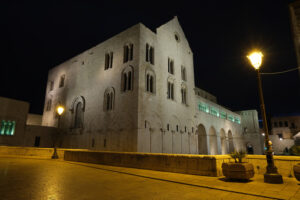 Basilica of San Nicola in Bari and Via Venezia on the wall. Shooting with night light and street lamps. Foto Bari photo.