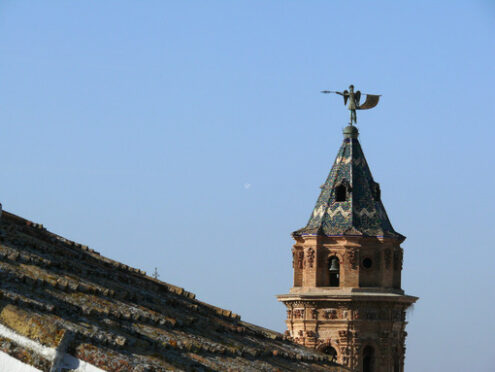 Glazed tile roof. Bell tower of the church of Antequera in Spain.