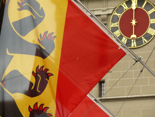 Bern, Switzerland. 08/02/2009. Swiss watch flag and clock face. Foto Svizzera. Switzerland photo