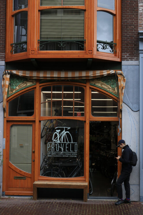 Bicycle shop with bay window and bow window in wood and glass. A - MyVideoimage.com