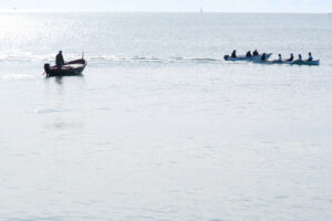 Boat whit athletes. Fisherman’s boat in the Ligurian sea, Gulf of La Spezia and boat with athletes in regatta training. - MyVideoimage.com | Foto stock & Video footage