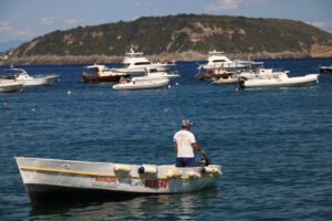 Boats anchored in front of the island of Ischia. - MyVideoimage.com