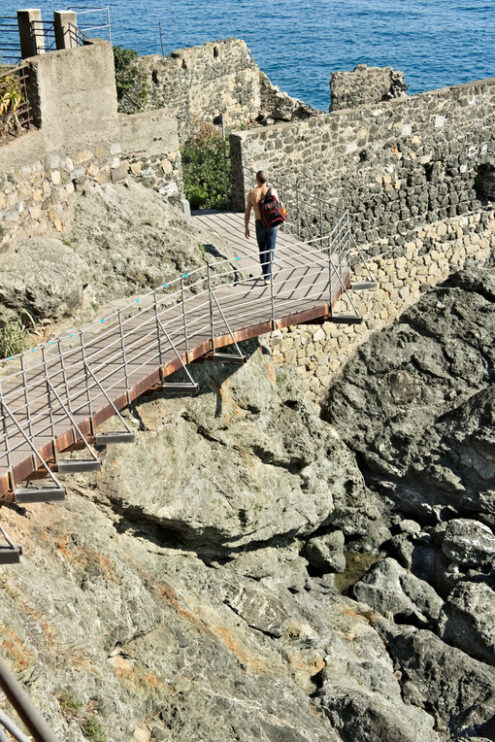 Boy walks on a path. Boy walks on a path in Framura, near the Cinque Terre. - MyVideoimage.com | Foto stock & Video footage