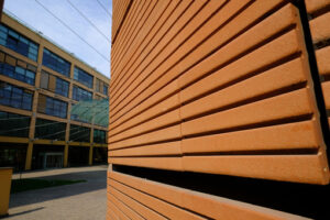 Brick building. Modern building with terracotta brick facade. Stock photos. - MyVideoimage.com | Foto stock & Video footage