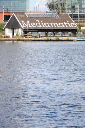 Building facing the canal. Mediamatic restaurant. Signboard pain - MyVideoimage.com