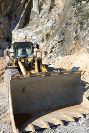 Bulldozer in a quarry. Bulldozer in a Carrara marble quarry. A large  mechanical shovel - MyVideoimage.com | Foto stock & Video footage