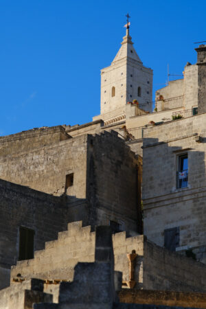 Case di Matera, Basilicata Houses and bell tower in the city of Matera in Italy. The tuff blocks are the material used for the construction of the houses. - MyVideoimage.com | Foto stock & Video footage