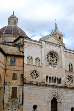 Cathedral of San Feliciano in Foligno with historic buildings. The Romanesque church with stone facades in Piazza della Repubblica. - MyVideoimage.com