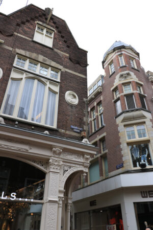 Characteristic and picturesque houses in the city center. Brick facades with white windows. Decorations on the facade. - MyVideoimage.com