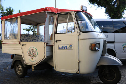 Characteristic taxi with motorcycle Ape parked on a street in Is - MyVideoimage.com