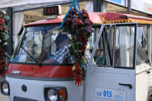 Characteristic taxi with motorcycle Ape parked on a street in Is - MyVideoimage.com