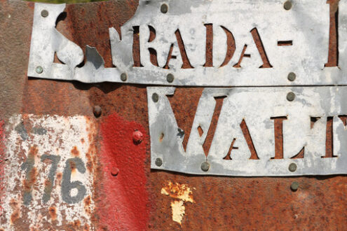 Characters engraved. Old characters engraved on steel sheet (Walton road) and symbol marks CAI path No. 176. Apuan Alps. - MyVideoimage.com | Foto stock & Video footage