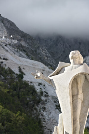 Christ of the quarryman. Colonnata. Marble quarries in Colonnata and monument to the quarryman.  The town is famous for the lardo di Colonnata and for the extraction of the white Carrara marble. Colonnata, Carrara, Tuscany, Italy. - MyVideoimage.com | Foto stock & Video footage