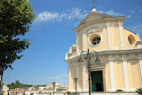 Church in Ischia Porto. Church facade on the background of blue. Foto Ischia photos.