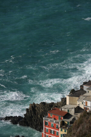 Cinque Terre panorama. Panorama of the village of Riomaggiore in the Cinque Terre. Rough sea with waves on the cliff. - MyVideoimage.com | Foto stock & Video footage