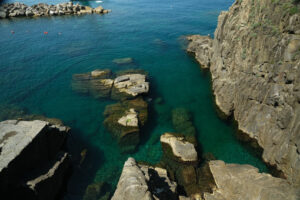 Cinque Terre sea Blue sea and cliff in Riomaggiore. Royalty free photos. - MyVideoimage.com | Foto stock & Video footage