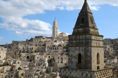 City of Matera. Point of two bell towers and church in the ancient city of Matera in Italy. Construction with blocks of tufa stone. - MyVideoimage.com | Foto stock & Video footage