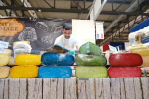 Colorful French cheeses in a stand at the craft fair. - MyVideoimage.com