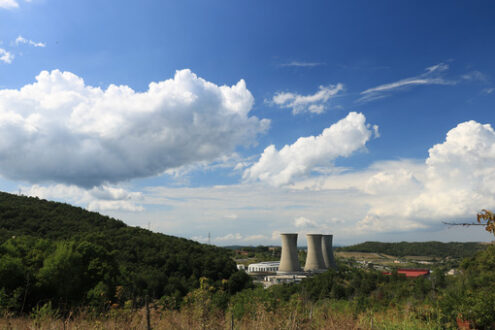 Condensation tower. Geothermal power plant for electricity production. Condensation towers in reinforced concrete. Landscape with sky and clouds. Larderello, Tuscany - MyVideoimage.com | Foto stock & Video footage