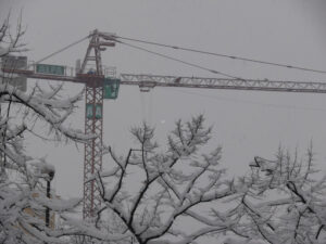 Construction crane and trees under the snow. - MyVideoimage.com