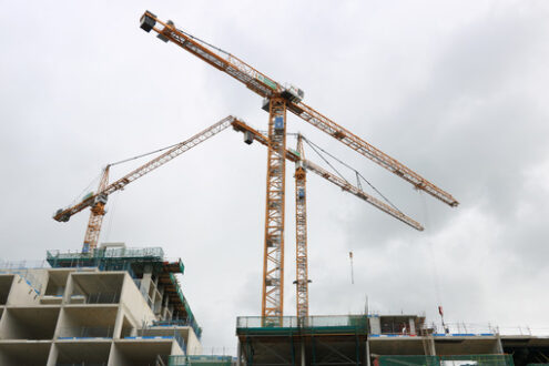 Construction site with cranes in Amsterdam. Construction of a ne - MyVideoimage.com