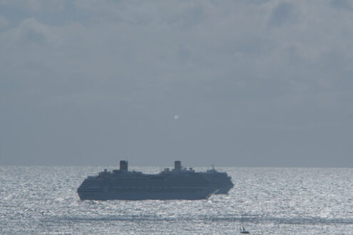 Cruise ships at sea. Cruise ships in the distance anchored in the rough sea. Stock photos. - MyVideoimage.com | Foto stock & Video footage