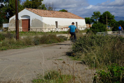 Cycling in the park of Cagliari. Person cycling in the park of Cagliari. Stock photos. - MyVideoimage.com | Foto stock & Video footage