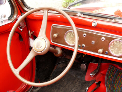 Dashboard with tools and steering wheel of a vintage car. - MyVideoimage.com