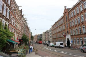 De Pijp, Amsterdam. Palaces of the De Pijp district built in the nineteenth century on the basis of the projects designed by the architect Hendrik Petrus Berlage. Italian restaurant sign. - MyVideoimage.com | Foto stock & Video footage