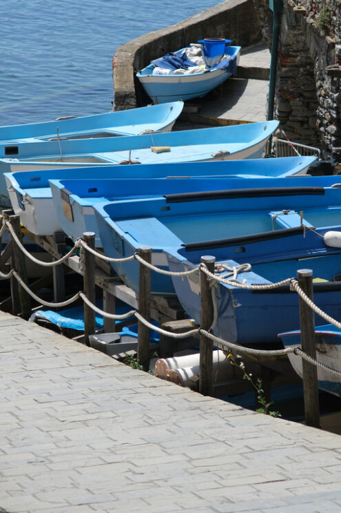 Dry boats parked in the town square during the coronavirus in the Cinque Terre.  Royalty Free Photos. - MyVideoimage.com | Foto stock & Video footage