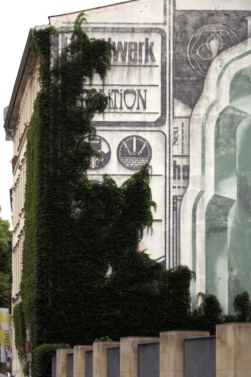 East Berlin palace with mural on the façade and a climbing plant - MyVideoimage.com