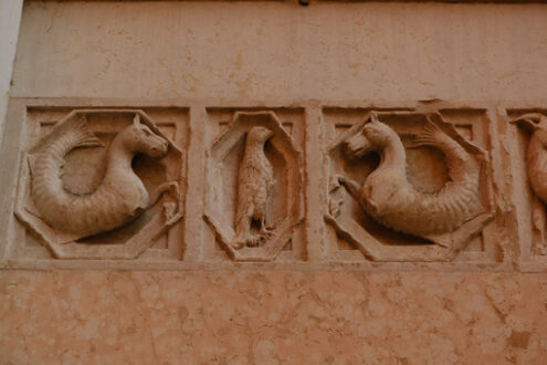 Embossments in relief on the facade of the baptistery of Parma. Sculptures on red marble from Verona - MyVideoimage.com