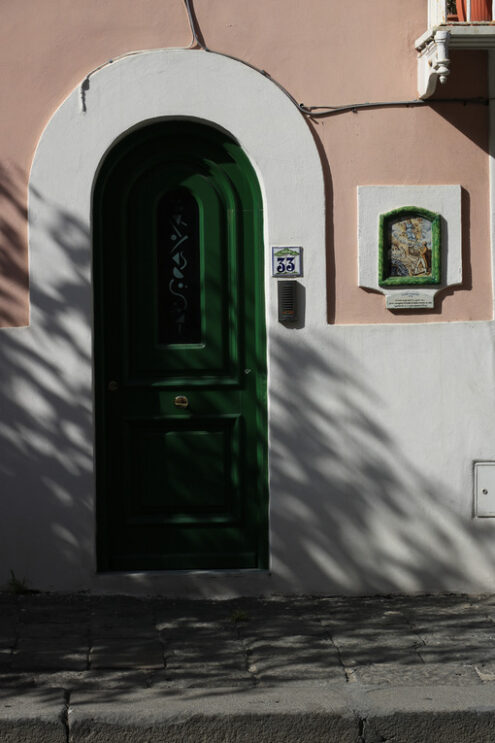 Entrance door to a Mediterranean home. Green plasters and cerami - MyVideoimage.com